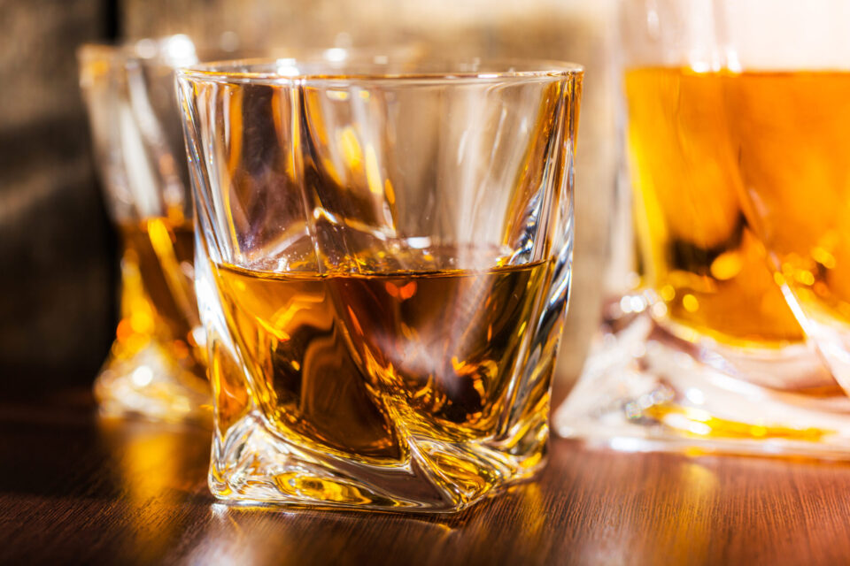 whiskey glass in the dark close up